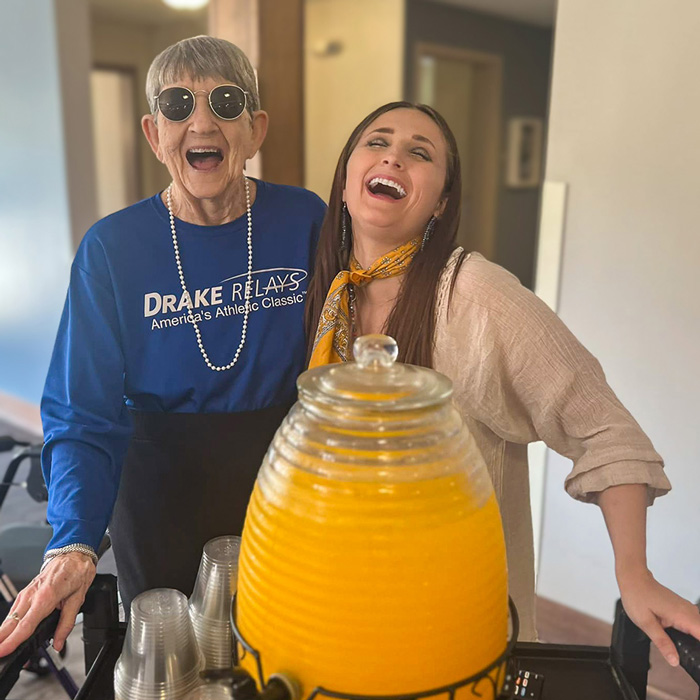 Celebrating National Assisted Living Week with bright smiles and fresh orange juice.